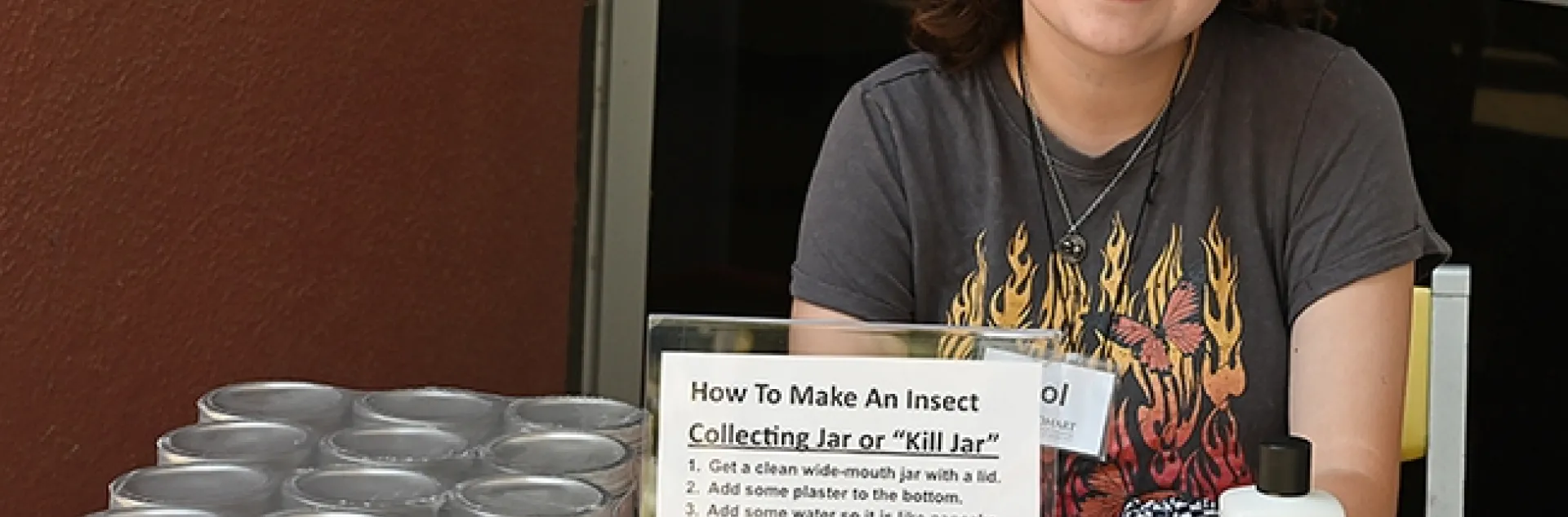 UC Davis entomology senior Sol Wantz, president of the Entomology Club, showed open house visitors how to make an insect collecting jar or "kill" jar. (Photo by Kathy Keatley Garvey)