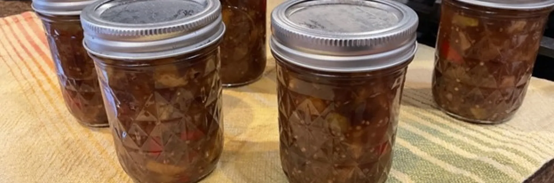 Processed jars resting on towel on counter