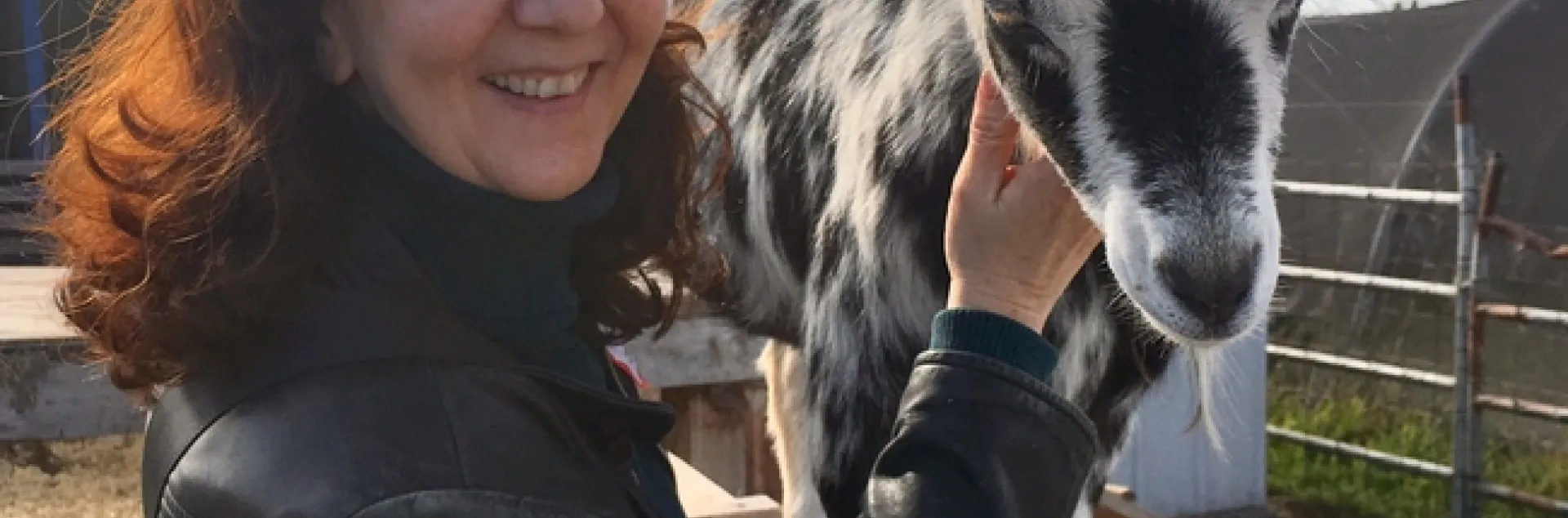 Rachel shown with a black & white goat.