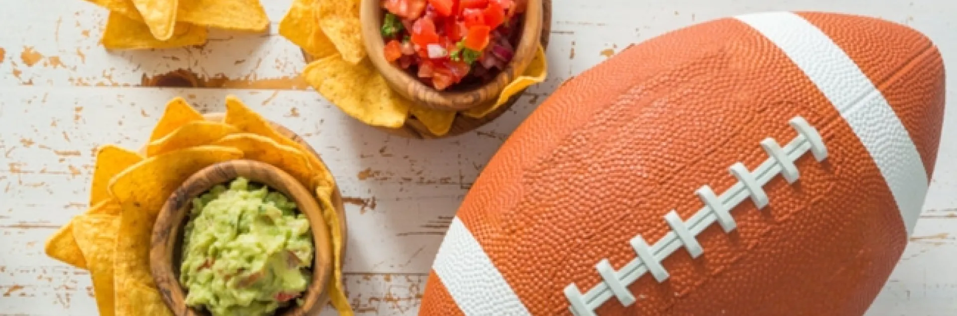 Photo from FoodSafetyNews.com picture of football with snacks