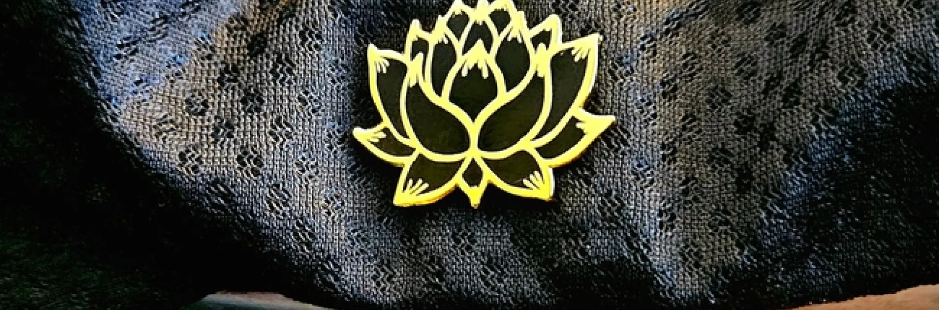 Lotus flower pin on hat - P. Pashby