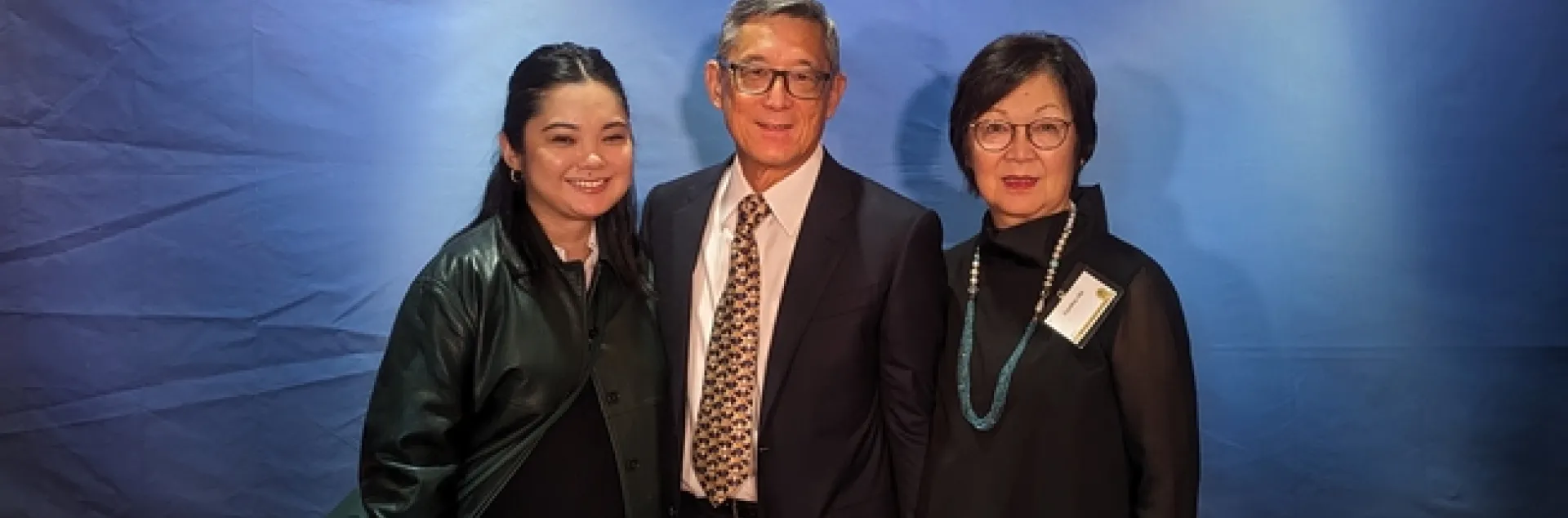 A family with a wife and husband with their daughter.