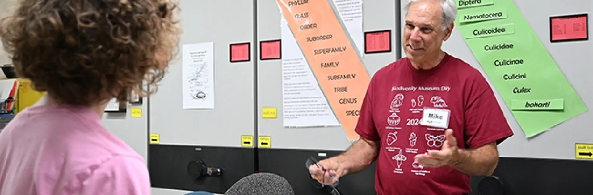 Bohart Museum associate Michael Pitcairn, retired from the California Department of Food and Agriculture, answers questions about silkworm moths and textiles. (Photo by Kathy Keatley Garvey)