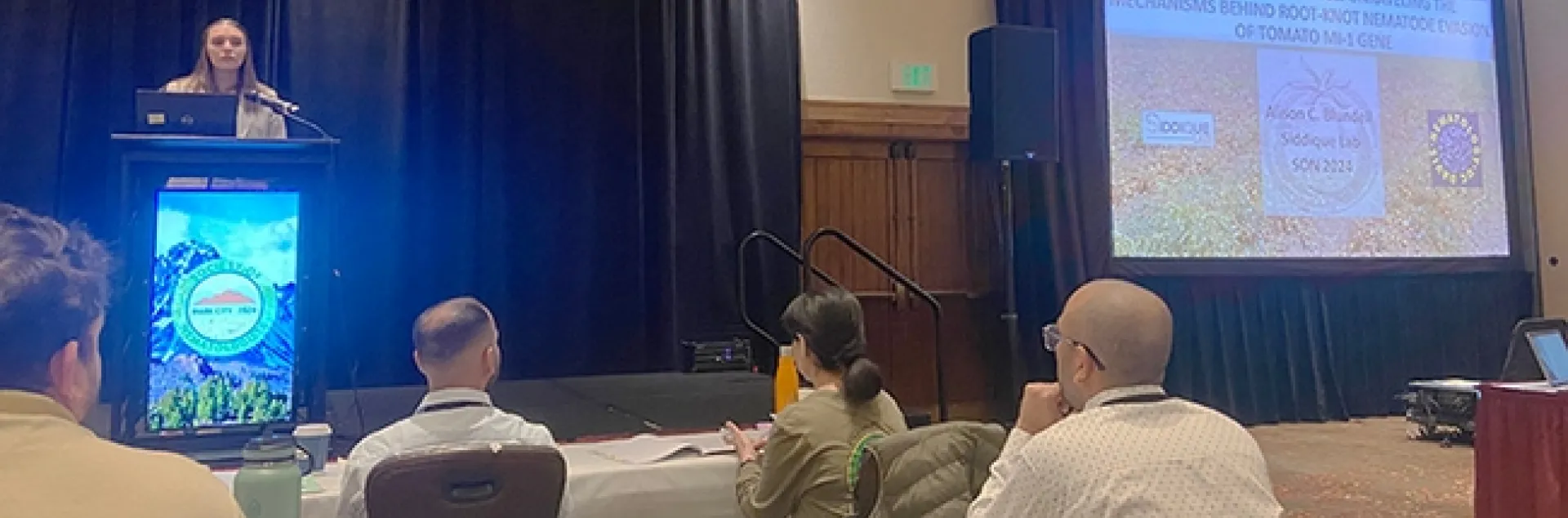 Doctoral candidate Alison Blundell delivering her award-winning presentation in the 12-minute student competition at the international Society of Nematologists. She won second place. (Photo by Veronica Casey)
