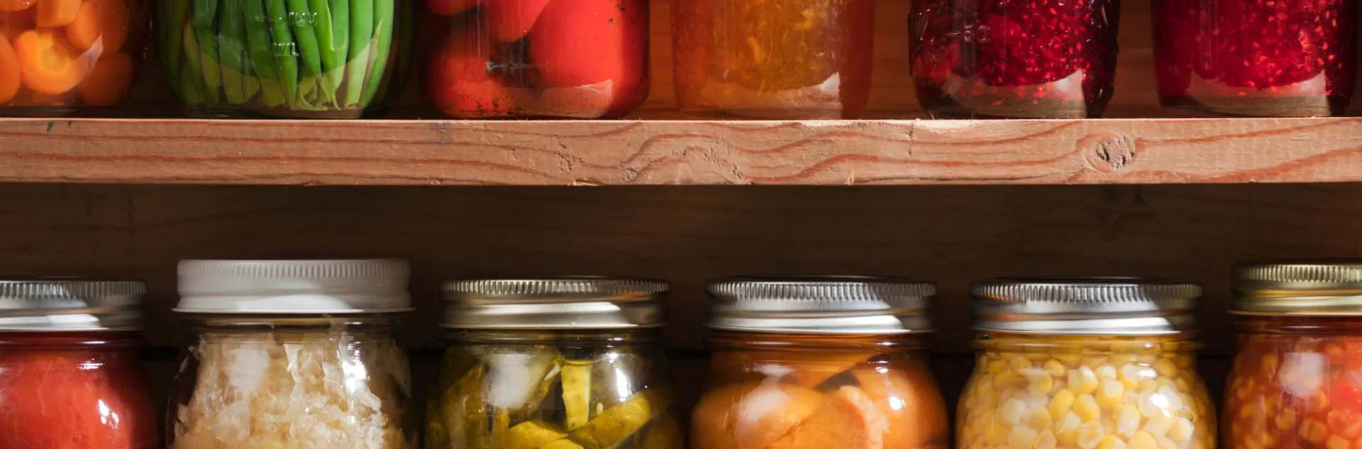Jars of colorful preserved foods.