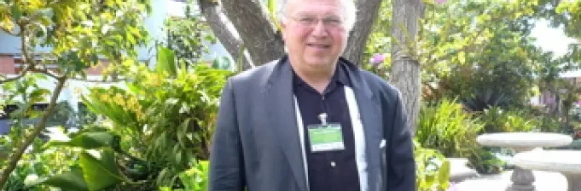 David Zilberman stands in a garden