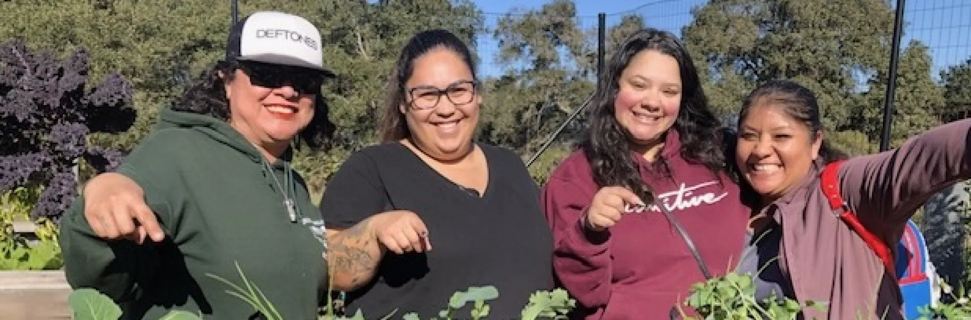 Women celebrating their new portable edible garden bags