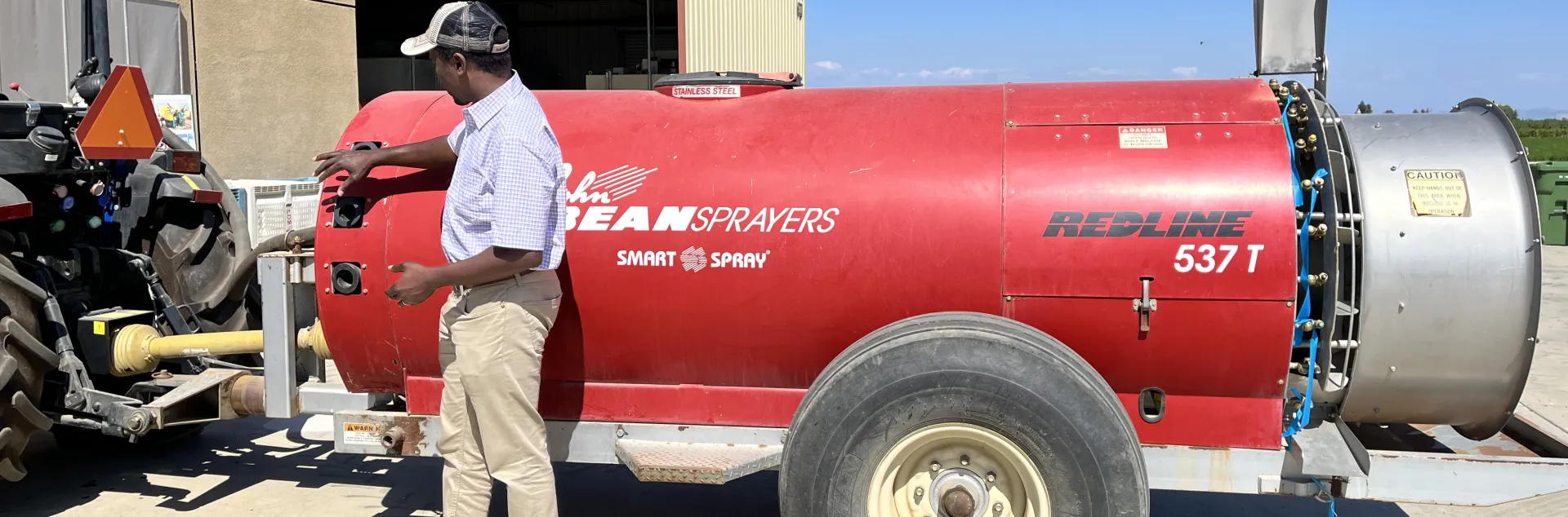 Peter points to a red spray rig