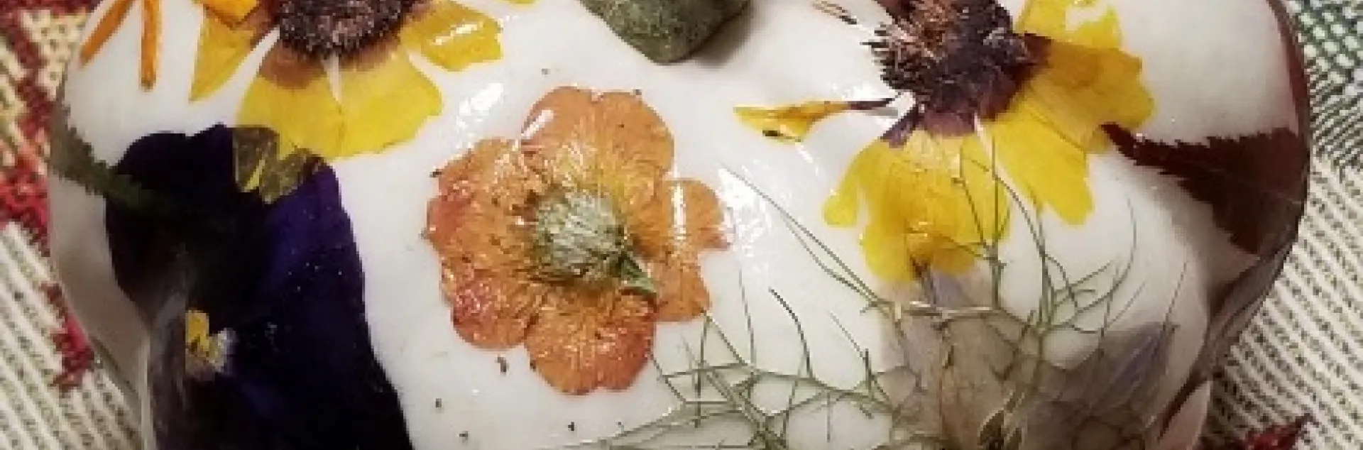 white pumpkin decorated with pressed flowers