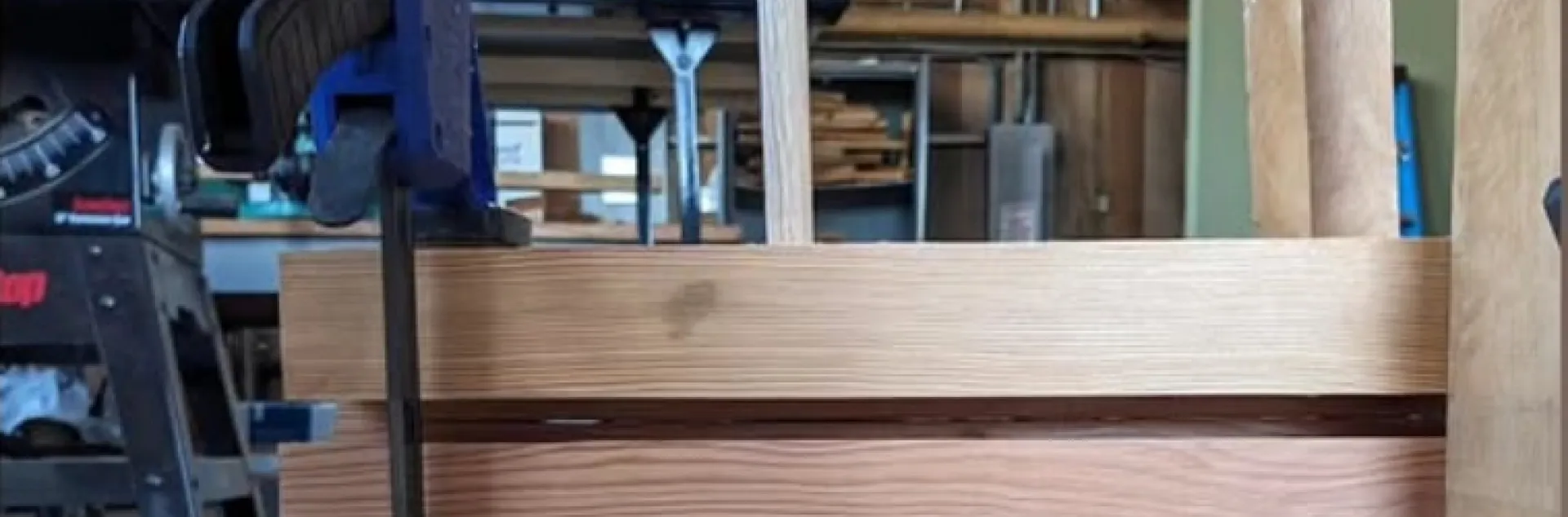 DLT with a dowel inserted through panels of wood