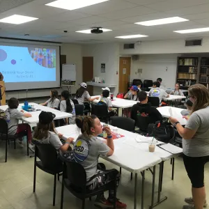 GROW program students seated in the large conference room learning about the 'Rethink Your Drink
