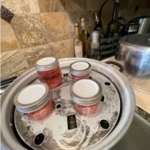 Filled jars in steam canner