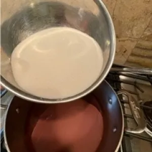 Adding sugar to lavender wine mixture