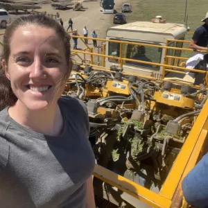 Self-photo of a women on a carrot harvester
