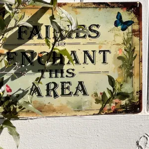 a sign reading "fairies enchant this area"