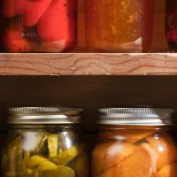 Jars of colorful preserved foods.